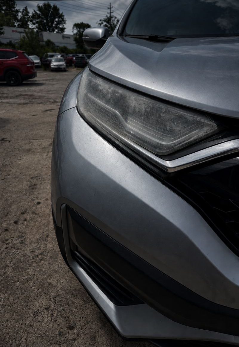Oxidized Honda CR-V headlight before restoration