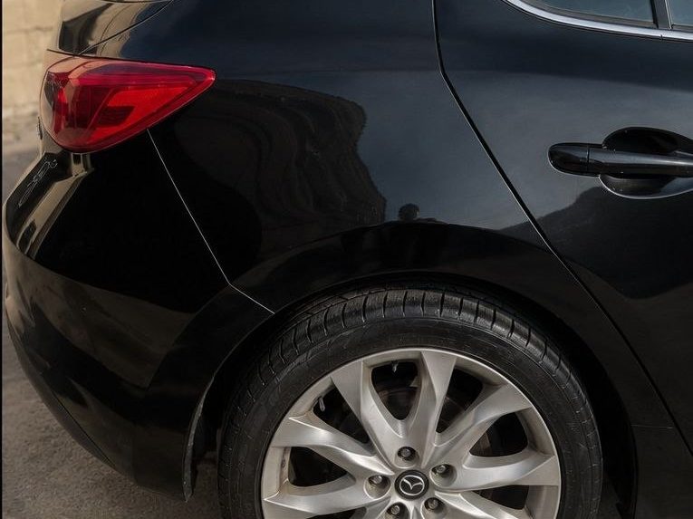 Black Mazda hatch after paint correction